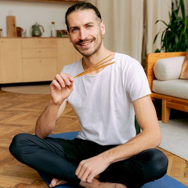 Person in a meditative state after a light cardio session, looking peaceful.